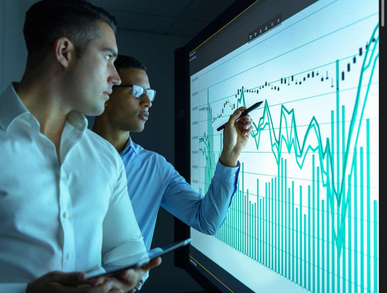 Strive Solutions team analyzing market data